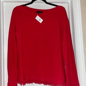 Ann Taylor sweater with fringe on hem and sleeves.